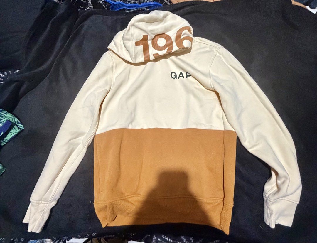GAP Colorblock Hoodie "196" Logo (Category: Coats, Jackets and Outerwear) located in Manila. Submitted by jayveepas (Listing ID 1461668628, Image 2). Description: - GAP cream and tan colorblock hoodie - Features 'GAP' logo vertically on the back - '196' detail on the hood - Ribbed cuffs and hem for a snug fit - Made from soft and comfortable material - Ideal for everyday casual wear.