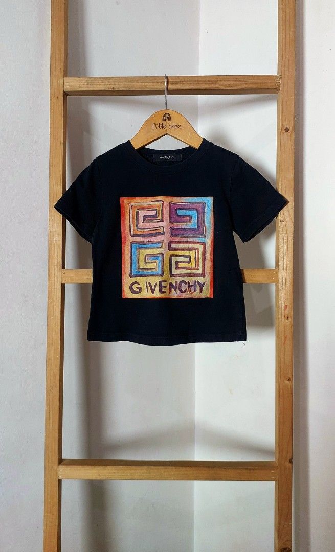 Givenchy Josh Smith Logo Print Black T-Shirt (Category: Babies & Kids Fashion) located in Caloocan City. Submitted by clairyyyyy (Listing ID 1461694702, Image 1). Description: - Authentic Black Givenchy T-shirt - Features unique Josh Smith abstract maze logo print - Colorful design with Givenchy name at the bottom - Ideal for Givenchy enthusiasts and collectors - High-quality fabric and print issue: Crack print pero likenew pa pinaka tela super b