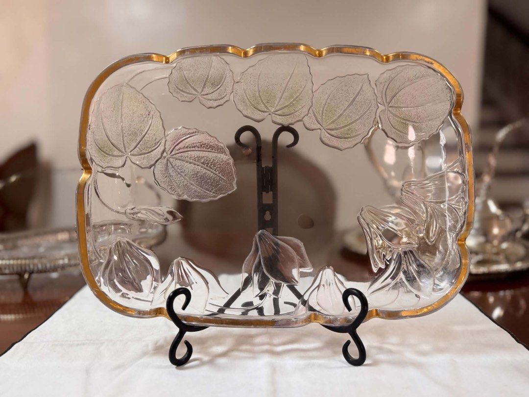 Glass and Ceramic Serving Platters and Bowls Set (Category: Dinnerware & Cutlery) located in Paranaque City. Submitted by dpmnmlst (Listing ID 1461640493, Image 1). Description: - Clear glass rectangular tray with elegant gold trim and leaf design. - Round clear glass plate featuring an embossed pattern. - Four (4) small square bowls in a vibrant green hue. - One (1) larger green serving dish. - Yellow rectangular tray adorned with a cheerful lem