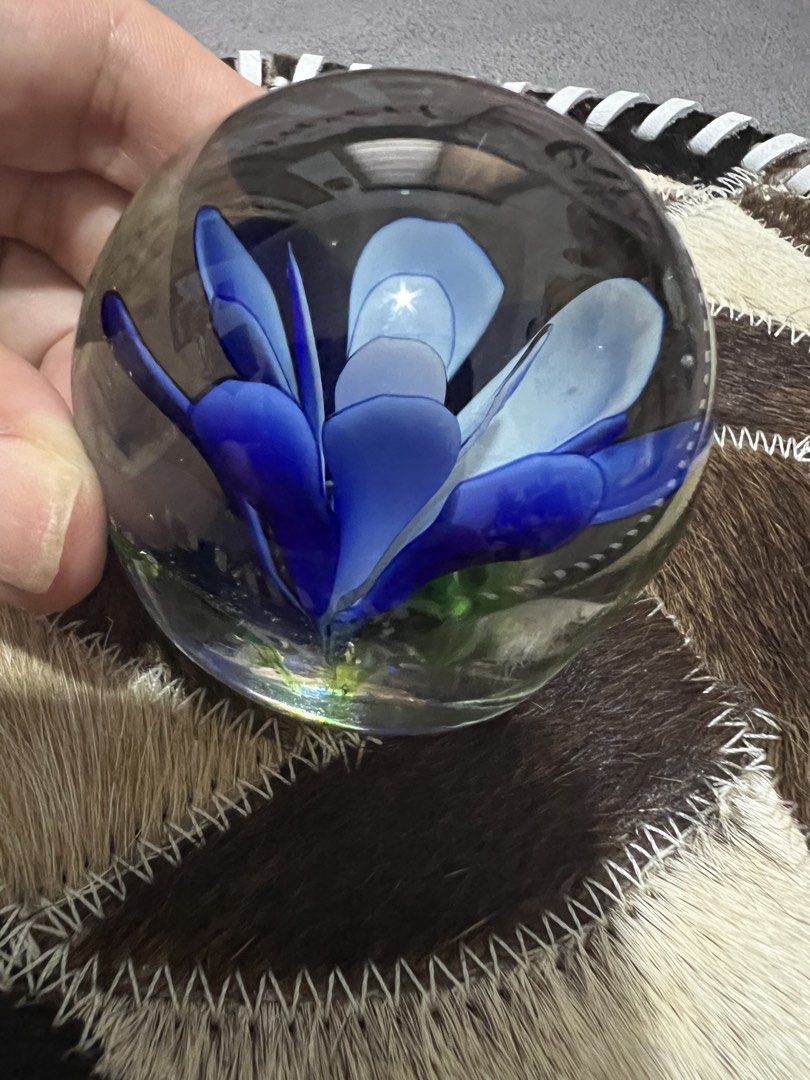 Glass Paperweight with Blue Flower Inside (Category: Vases & Decorative Bowls) located in Las Pinas. Submitted by maple0305 (Listing ID 1461645766, Image 3). Description: - Delicate blue flower encased in clear glass sphere. - Adds a beautiful pop of color to any desk or shelf. - Functional as a paperweight or purely decorative. - Intricate floral design. - A lovely addition to any collection..