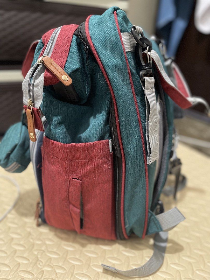 GOOD MUM - BABY BACKPACK (Category: Other Baby Bathing & Changing Needs) located in Manila. Submitted by loveditemsbyj (Listing ID 1461707201, Image 3). Description: - Brand: GOOD MUM - Product Type: Baby Backpack - Condition: Layer 4 (Excellent) - Design: Color block with quilted front panel - Features: Includes a detachable pouch - Ideal for: Carrying baby essentials, travel, daily outings BOUGHT THIS FROM AMERICA, 2x lang nagamit!.