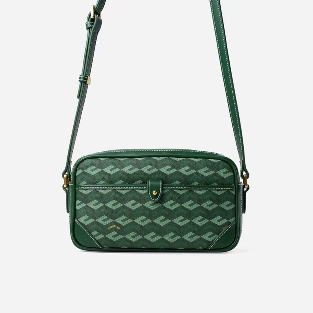 Green Monogram Crossbody Bag (Category: Cross-body Bags) located in Manila. Submitted by moobrava (Listing ID 1461793132, Image 1). Description: - Stylish green crossbody bag - Features a repeating monogram pattern - Elegant leather trim and stitching details - Adjustable strap for comfortable wear - Convenient small snap closure on the front pocket - Ideal for everyday use and carrying your essentials.