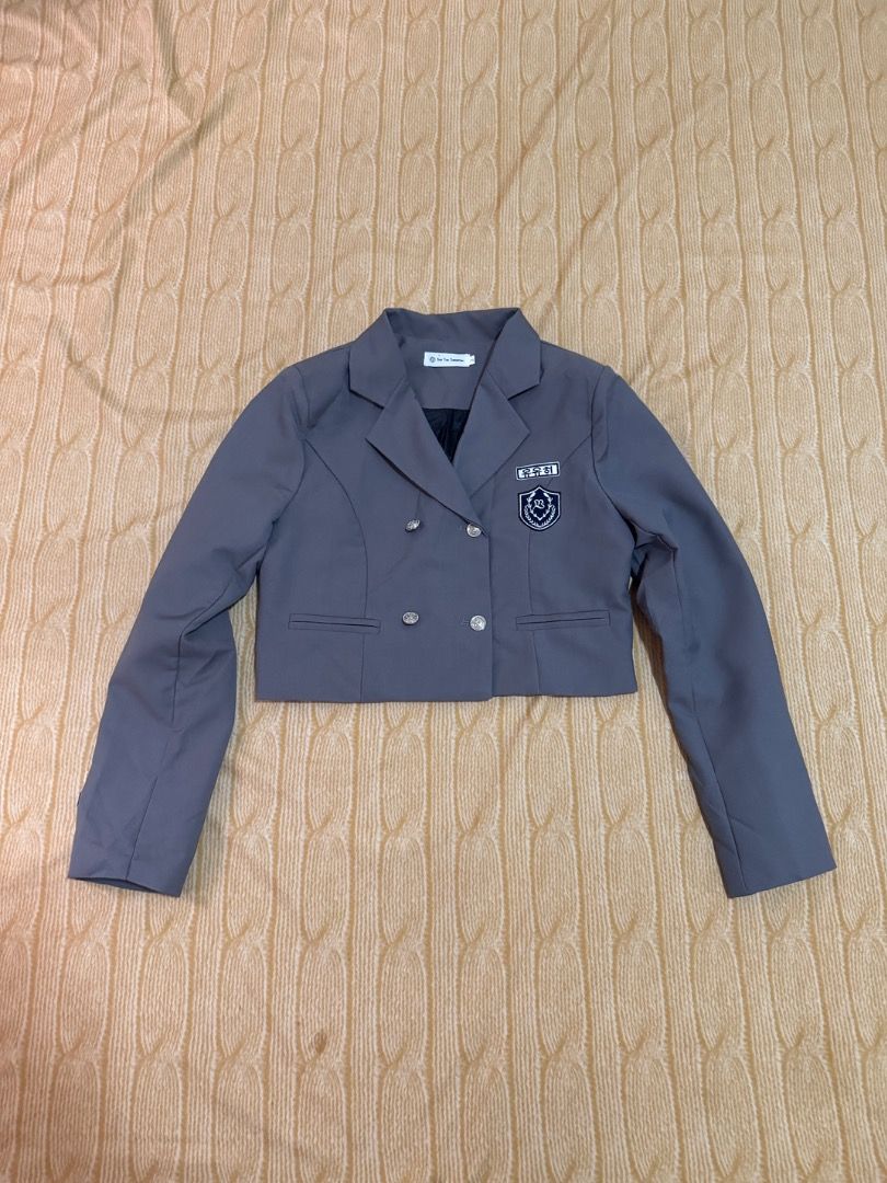 Grey Cropped Double-Breasted Blazer with Patch (Category: Coats, Jackets and Outerwear) located in Calasiao. Submitted by clothesbykim (Listing ID 1461699675, Image 1). Description: - Grey cropped blazer - Double-breasted style - Silver button details - Patch on left chest with Korean text and crest - School uniform-inspired design - Short length, very chic - Ideal for layering.