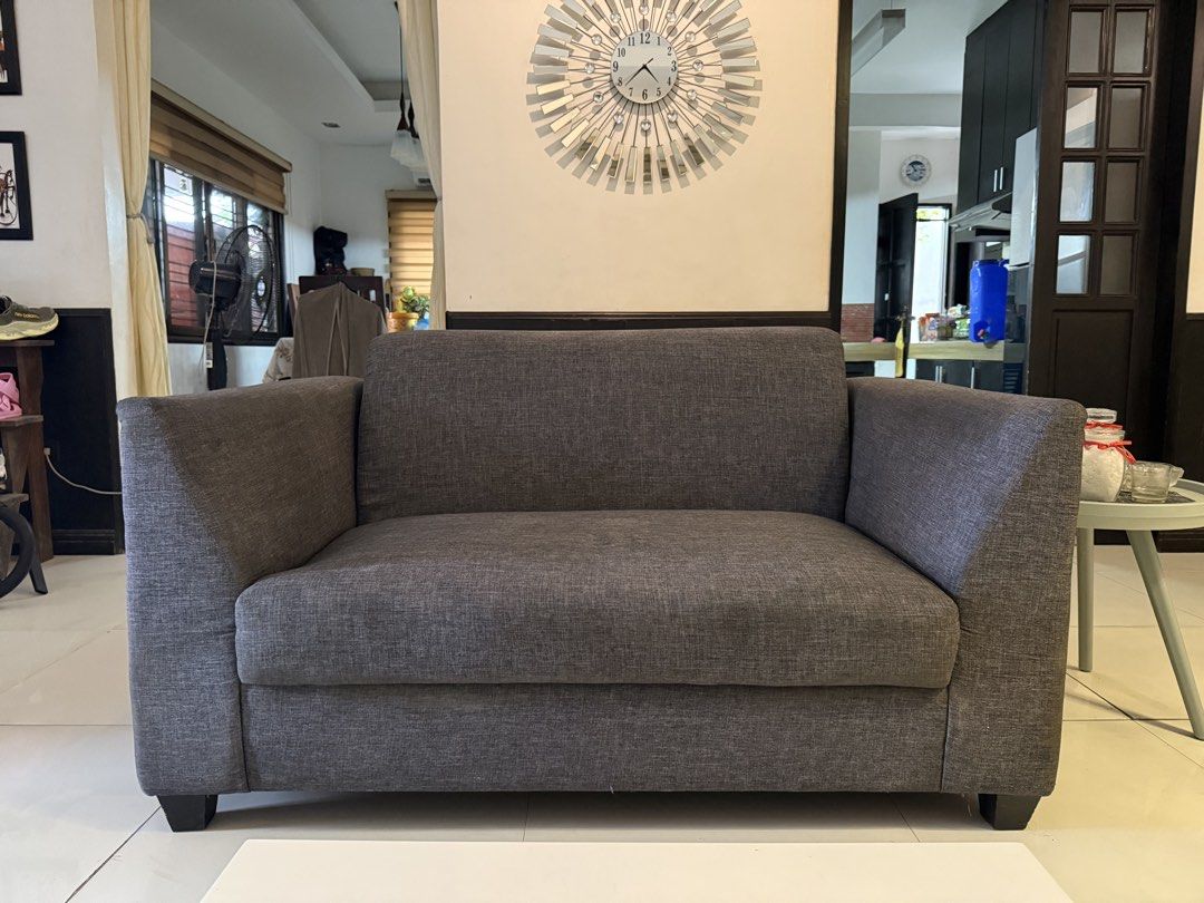 Grey Fabric L-Shaped Sofa with Chaise (Category: Sofas) located in Las Pinas. Submitted by whoshotcupid (Listing ID 1461591980, Image 3). Description: - Comfortable grey fabric sofa - Features a chaise lounge for extra lounging space - Comes with 3 decorative throw pillows - Ideal for living rooms or apartments.