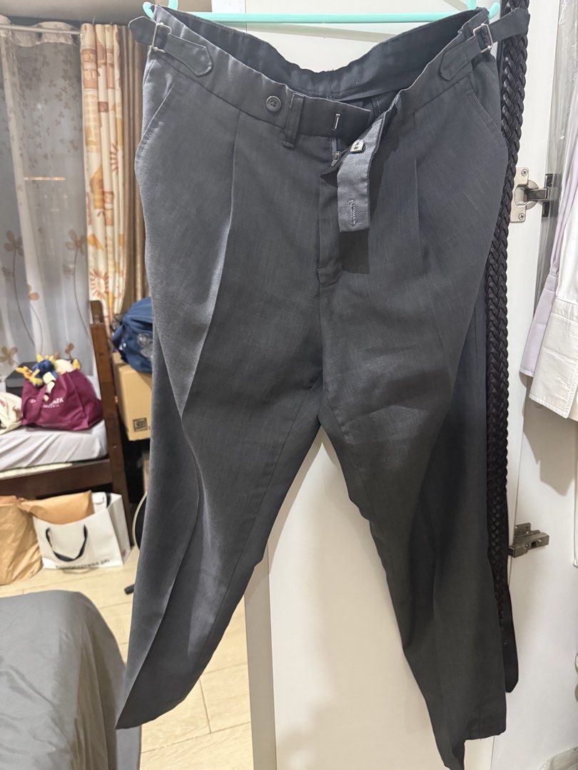 Grey Formal Trousers (Category: Trousers) located in Manila. Submitted by derrickgua31823 (Listing ID 1461685717, Image 1). Description: - Classic fit single-pleat grey tailored trousers - Belt loops and side adjusters - Two front and two back pockets for convenience - Secure button and zip closure - Versatile for work or smart casual wear RFS: dont fit me anymore.