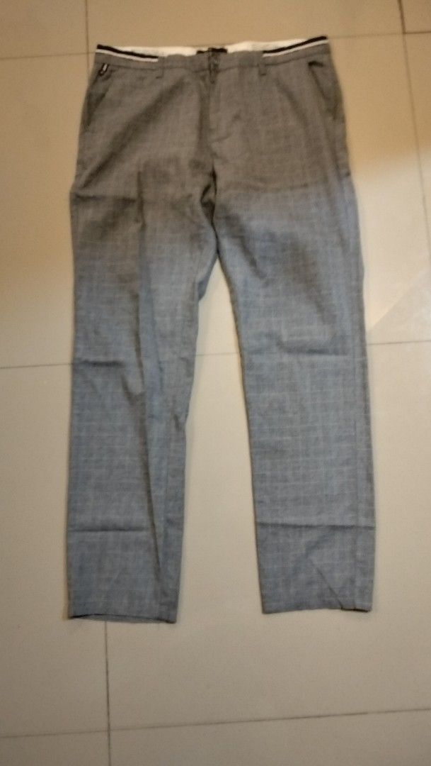 Grey Plaid Dress Pants Size 34 (Category: Trousers) located in Angeles City. Submitted by mightywhale_13072f (Listing ID 1461701213, Image 1). Description: - Grey plaid dress pants - Size 34 - Made in Italy - Perfect for smart casual or formal wear - Comfortable fit.