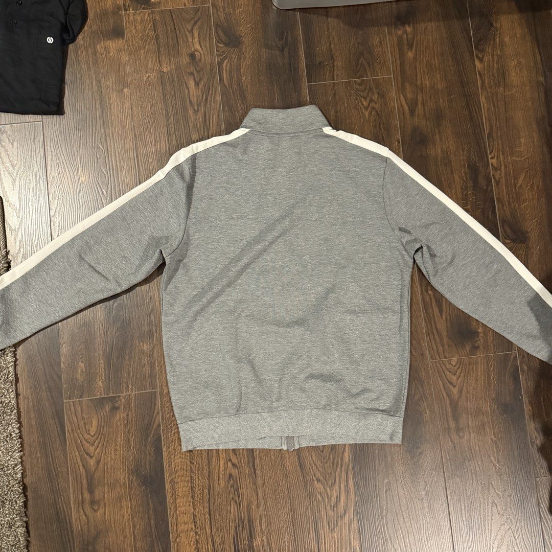 T7 Grey Puma Track Jacket with White Stripes (Category: Coats, Jackets and Outerwear) located in Manila. Submitted by monkemon (Listing ID 1461584575, Image 2). Description: - Grey Puma track jacket - White stripes on sleeves and shoulders - Full zip closure - Two front pockets - Comfortable material - Ideal for casual wear or sports.