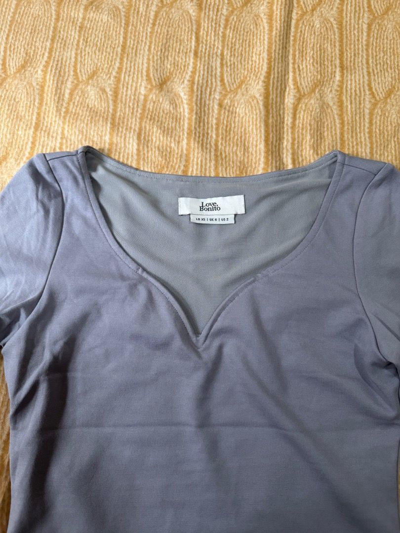 Grey V-neck Long Sleeve Top (Category: Longsleeves) located in Calasiao. Submitted by clothesbykim (Listing ID 1461694445, Image 2). Description: - Grey long-sleeved top - V-neckline - Soft and stretchy fabric - Fitted silhouette - Great for layering or wearing on its own - Simple and versatile wardrobe staple.