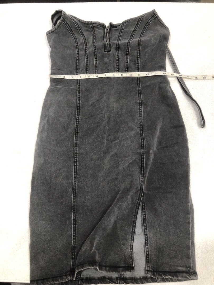 Grey Wash Denim Dress with Front Slit (Category: Dresses) located in Manila. Submitted by janmichael26601 (Listing ID 1461608828, Image 1). Description: - Grey wash denim dress - Front zipper closure - Thigh-high slit for a stylish look - Adjustable straps for a perfect fit - Made in China - Measurements: Waist - 14 inches, Length - 30 inches.