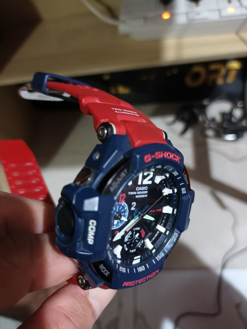 G-Shock GA-1100 Twin Sensor Watch (Category: Men's Watches) located in Manila. Submitted by markdelfin1979 (Listing ID 1461789495, Image 2). Description: - G-Shock GA-1100 Watch - Striking Blue and Red Colorway - Twin Sensor (Temperature & Direction) - World Time Functionality - Alarm Feature - 20 Bar Water Resistance (200m) - Authentic, Made in Thailand - Includes Original G-Shock Tin - Ideal for Everyday Wear and Outdoor Activities.