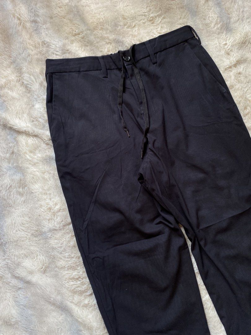 GU Black Trousers with Drawstring Waist (Category: Trousers) located in Andop. Submitted by safewater-895a (Listing ID 1461605380, Image 3). Description: - Classic navy blue trousers - Adjustable drawstring waist for a comfortable fit - Secure button and zip front closure - Convenient side pockets - Functional back pockets - Versatile for casual and smart-casual occasions - Ideal for everyday wear - Waistline: 30-32 - Lenght: 37.