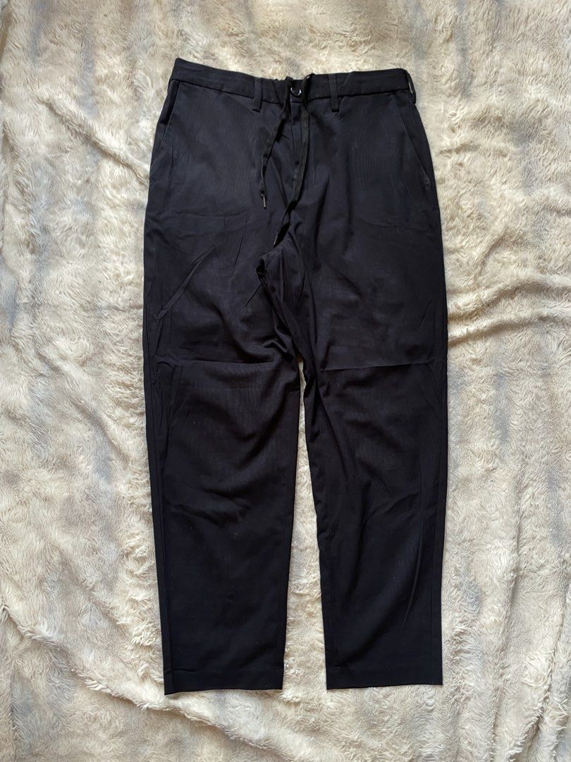 GU Black Trousers with Drawstring Waist (Category: Trousers) located in Andop. Submitted by safewater-895a (Listing ID 1461605380, Image 2). Description: - Classic navy blue trousers - Adjustable drawstring waist for a comfortable fit - Secure button and zip front closure - Convenient side pockets - Functional back pockets - Versatile for casual and smart-casual occasions - Ideal for everyday wear - Waistline: 30-32 - Lenght: 37.