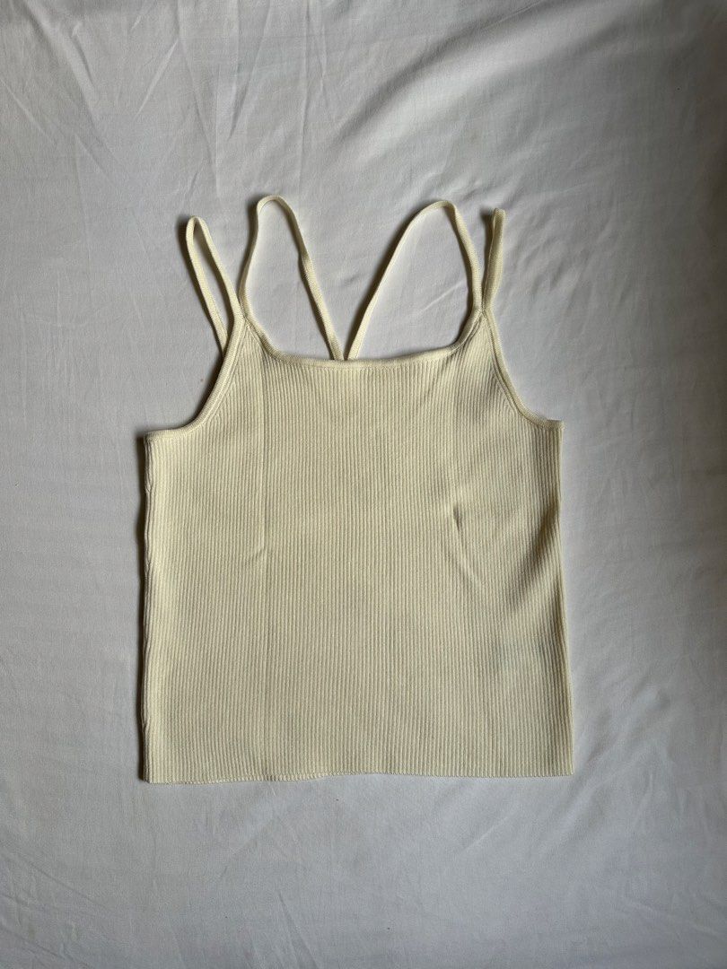 GU Ribbed Knit Tank Top (Category: Sleeveless) located in Bacolod City. Submitted by pym_shops (Listing ID 1461701624, Image 1). Description: - GU Cream Ribbed Knit Tank Top - Square neckline - Criss-cross straps at the back - Material: Polyester and Nylon blend - Comfortable and versatile for layering or standalone wear - Easy to style with various outfits - A wardrobe essential.