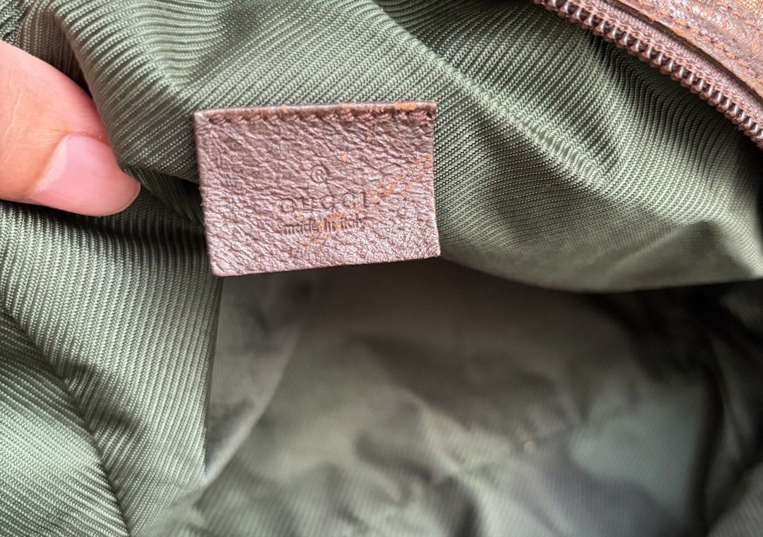 Gucci Authentic (Category: Luxury Bags & Wallets) located in Pasig City. Submitted by flamecloset (Listing ID 1461667940, Image 2). Description: Gucci Tofu Authentic Mini hand bag - Classic GG Monogram Canvas (Brown) - Genuine Leather Trim - Interior Green Lining - Serial number visible inside.