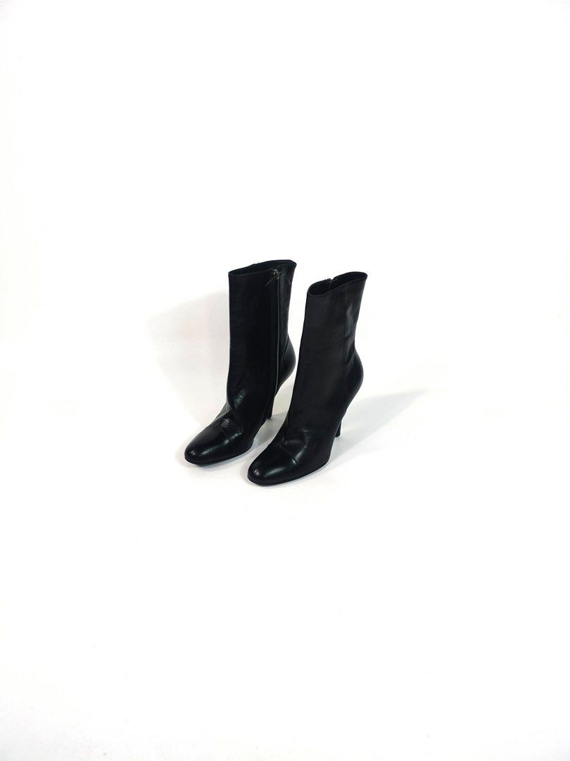 GUCCI Black Leather Heeled Ankle Boots (Category: Boots) located in Manila. Submitted by naphthrift (Listing ID 1461711515, Image 3). Description: - Sleek black leather ankle boots - Elegant pointed toe design - Convenient side zipper closure - Stylish stiletto heel for added height - Versatile for dressing up or down - Suitable for all seasons ISSUE‼️ - Tips, taps pins.