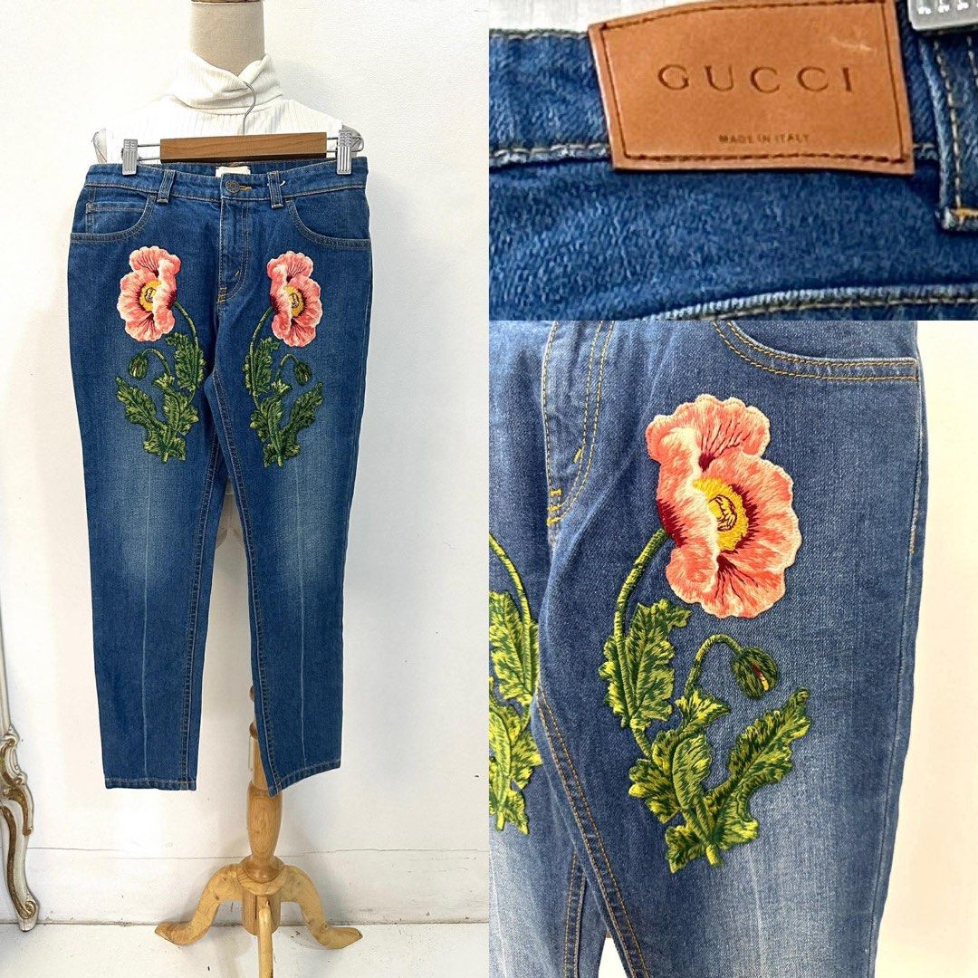 Gucci Embroidered Denim Jeans (Category: Jeans) located in Bacolod City. Submitted by bhabissagal-05763 (Listing ID 1461610297, Image 2). Description: - Authentic Gucci denim jeans - Beautiful floral embroidery on front - Classic blue wash with yellow stitching - Made in Italy - Button fly closure - Straight leg fit.