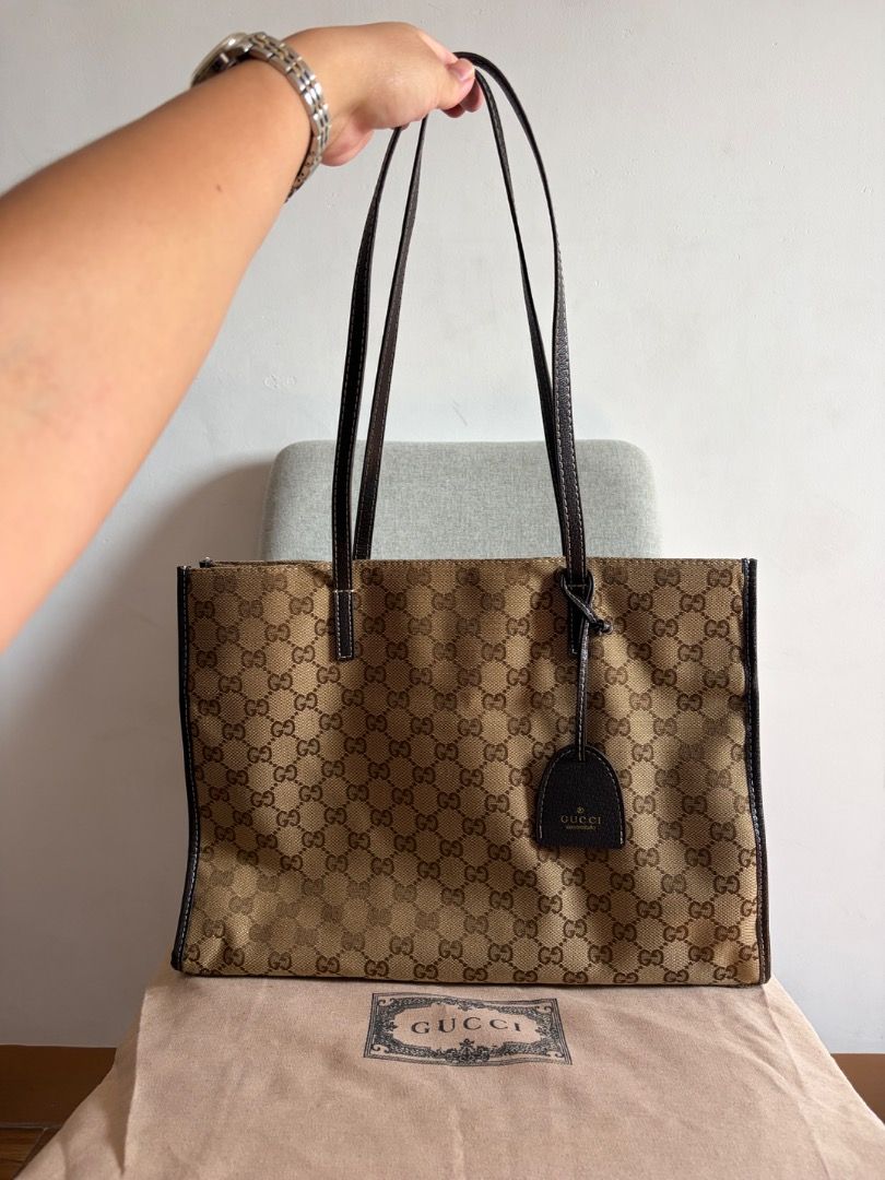 Gucci GG Monogram Canvas Tote Bag (Category: Luxury Bags & Wallets) located in Quezon City. Submitted by missclutterfree (Listing ID 1461705864, Image 2). Description: - Gucci tote bag - Classic GG monogram canvas with leather trim - Spacious interior with a zip pocket - Perfect for everyday use or travel - Comes with dust bag - large capacity tote bag - like new, no issues .