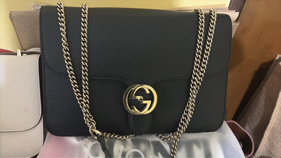 Gucci Interlocking G Shoulder Bag (Category: Luxury Bags & Wallets) located in Quezon City. Submitted by wellusedstuff (Listing ID 1461624026, Image 1). Description: - Authentic Black Leather Gucci Interlocking G Shoulder Bag - Elegant Gold Chain Strap - Iconic GG Logo Hardware - Spacious Interior - Versatile for Day or Night Use.