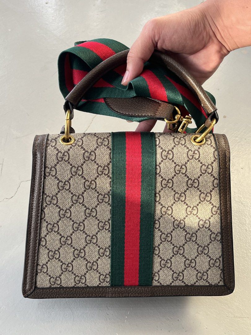 Gucci Queen Margaret GG Supreme (Category: Cross-body Bags) located in San Fernando. Submitted by archivalhighlights (Listing ID 1461670087, Image 2). Description: Gucci Queen Margaret GG Supreme Top Handle Bag featuring brown leather trim, the signature green-red-green Web stripe, a crystal-and-pearl-embellished metal bee clasp, a “Blind for Love” hanging leather tag, and a detachable web shoulder strap.