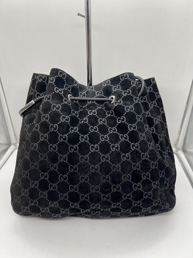 Gucci vintage black GG monogram suede drawstring shoulder bag (Category: Luxury Bags & Wallets) located in Cavite. Submitted by aellavier (Listing ID 1461589959, Image 2). Description: orig preloved vintage. honest issue: the drawstring leather needs re-gluing (due to being vintage, nagexpire na glue niya) manageable flaw doesnt affect the usability of the bag. needs minimal cleaning, no major flaws .