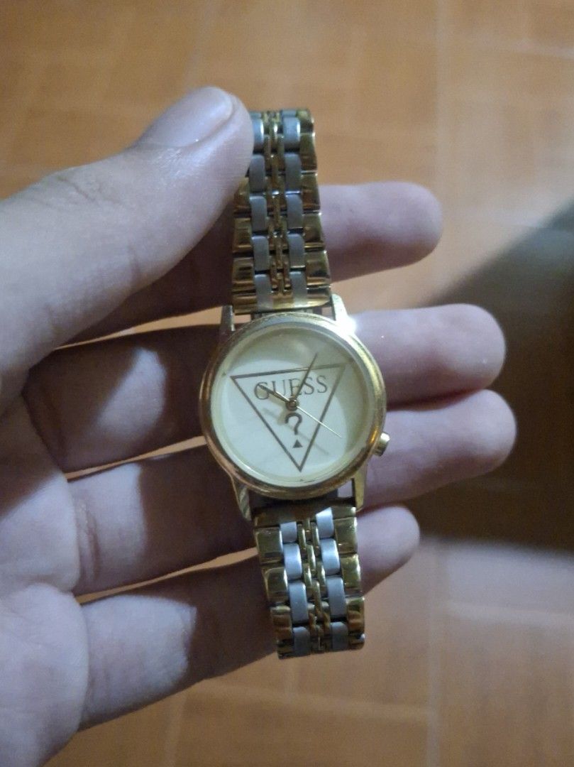 Guess Gold Tone Watch (Category: Women's Watches) located in Plaridel. Submitted by niannyyy (Listing ID 1461599641, Image 3). Description: - Gold tone Guess watch - Not Working need Battery replacement - Two-tone metal band - Guess triangle logo on the face - Simple and classic design - Ideal for everyday wear.