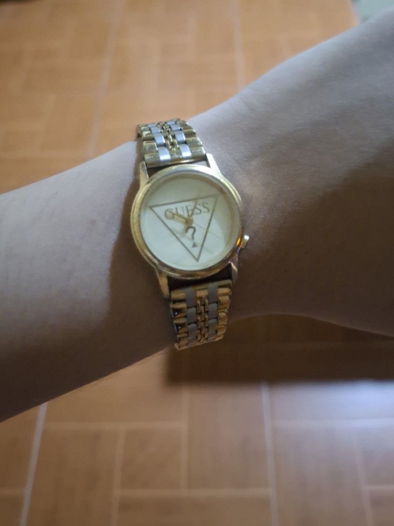 Guess Gold Tone Watch (Category: Women's Watches) located in Plaridel. Submitted by niannyyy (Listing ID 1461599641, Image 2). Description: - Gold tone Guess watch - Not Working need Battery replacement - Two-tone metal band - Guess triangle logo on the face - Simple and classic design - Ideal for everyday wear.