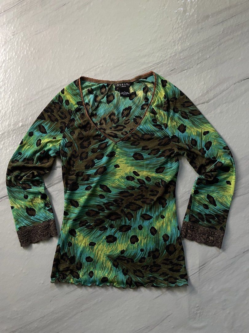 Guess Jeans Leopard Print Long Sleeve Mesh Top Size S (Category: Longsleeves) located in Midsayap. Submitted by archieaquino24 (Listing ID 1461624134, Image 1). Description: - Guess Jeans long sleeve top - Size: S - Print: Green, blue, and brown leopard and abstract pattern - Details: Lace trim on neckline and cuffs - Material: 100% Nylon - Style: Casual, edgy.