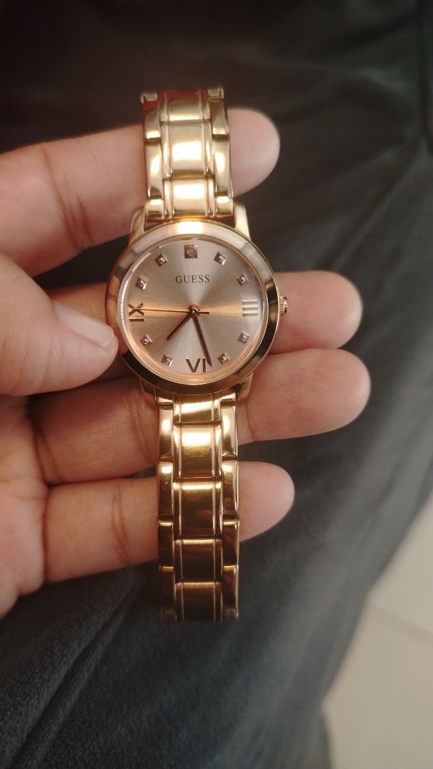Guess Rose Gold Watch (Category: Women's Watches) located in Manila. Submitted by wildwind_73f77a (Listing ID 1461568827, Image 3). Description: - Elegant rose gold Guess watch - Features Roman numeral hour markers - Accented with small diamond markers - Durable stainless steel band - Water resistant for everyday wear - Secure clasp with embossed Guess logo - Versatile for both casual and formal outfits.