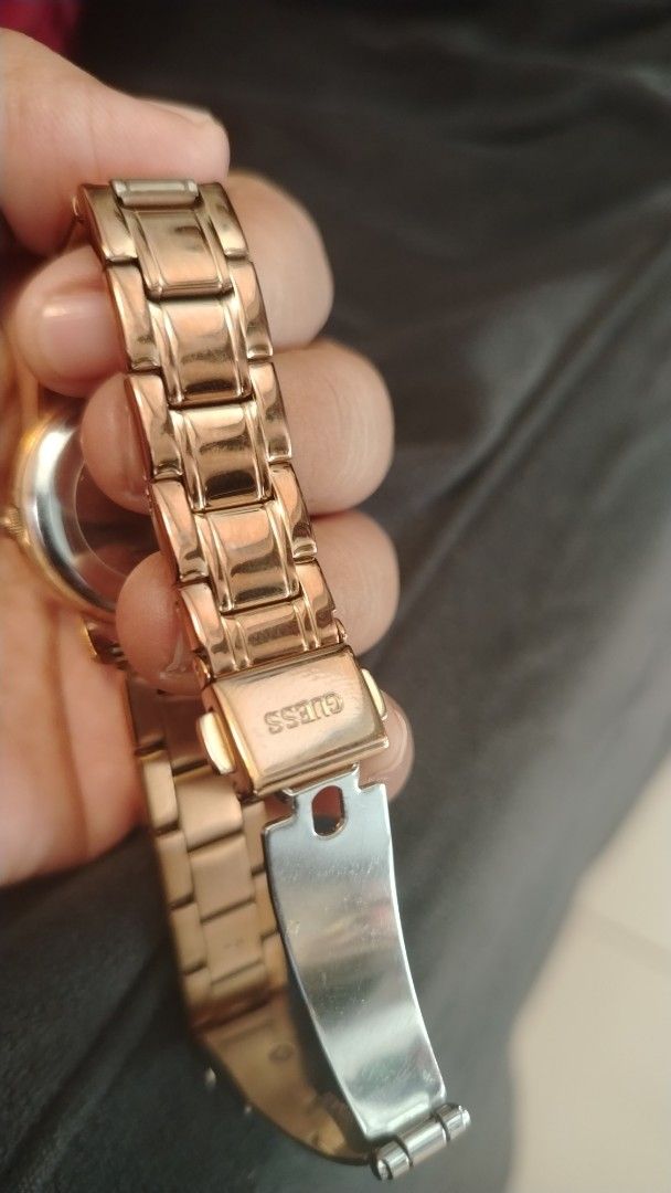 Guess Rose Gold Watch (Category: Women's Watches) located in Manila. Submitted by wildwind_73f77a (Listing ID 1461568827, Image 2). Description: - Elegant rose gold Guess watch - Features Roman numeral hour markers - Accented with small diamond markers - Durable stainless steel band - Water resistant for everyday wear - Secure clasp with embossed Guess logo - Versatile for both casual and formal outfits.
