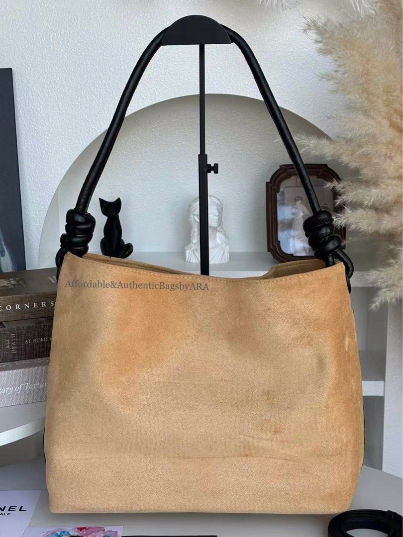 GWP CHANEL BEIGE SUEDE HOBO BAG (Category: Tote Bags) located in Daet. Submitted by ecassenluxuries (Listing ID 1461609632, Image 2). Description: 📍 PRE-ORDER ITEM ▫️Authentic Chanel GWP Hobo Bag ▫️Color: Beige Suede Exterior ▫️Handles: Black Leather with Knot Detail ▫️Interior: 1 Zippered Pocket ▫️Style: Great everyday bag ✅ All items are guaranteed 💯% AUTHENTIC ✅ Needs to settle 50% downpayment to secure your slot. ✅ Remaining balance should 