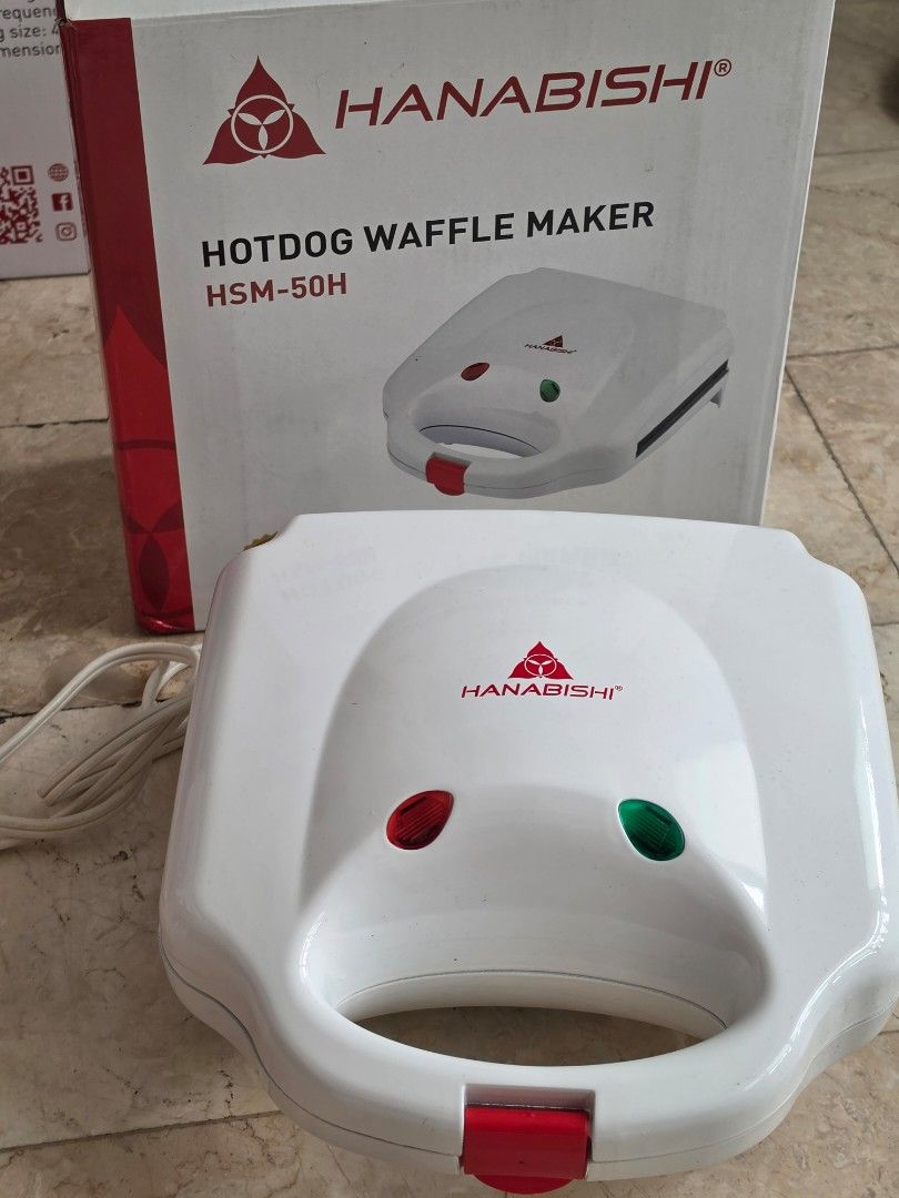 Hanabishi Hotdog Waffle Maker HSM-50H (Category: Other Kitchen Appliances) located in Caloocan City. Submitted by bravemountain_ddc4bf (Listing ID 1461609372, Image 3). Description: - Hanabishi Hotdog Waffle Maker, Model HSM-50H - Makes 6 hotdog waffles at once - Non-stick coated plates for easy cleaning - Safety thermal cut-out for secure operation - 2 pilot lights (power and heating indicator) - Convenient locking system - Operates on 230V - Id