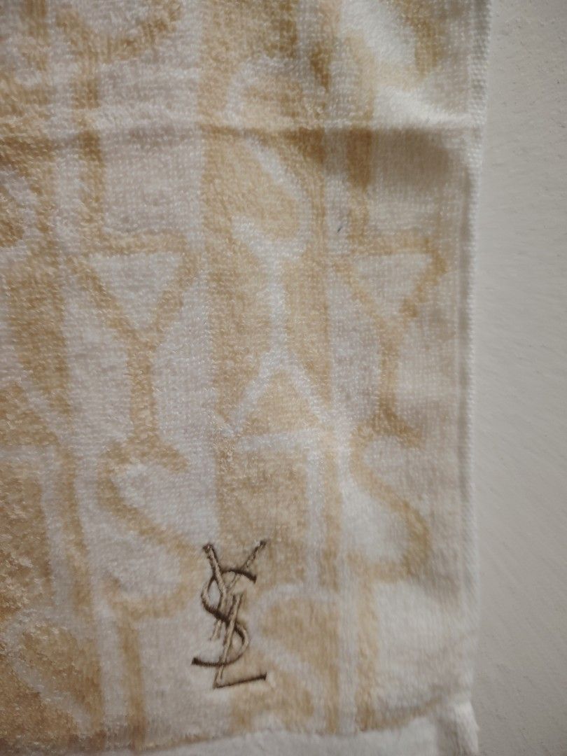 Handkerchief (Category: Other Accessories) located in Perai. Submitted by sweeties2433 (Listing ID 1461623913, Image 3). Description: - Brand: YVES SAINT LAURENT - Collection: Signature Monogram Hand Towel, Multi-Use Collection - Design: All-over YSL monogram pattern - Color: Beige and white - Versatile: Suitable for bathroom, gym, desk, or travel - Authentic YSL product.