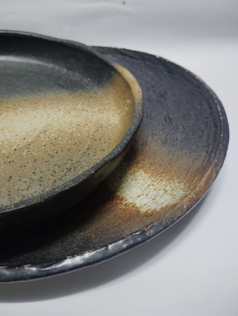 Handmade Ceramic Serving Plate Rustic Earth Tones (Category: Dinnerware & Cutlery) located in Manila. Submitted by epicrabbit-968a (Listing ID 1461748635, Image 3). Description: - Rustic ceramic plate - Unique earth-toned glaze - Textured surface for character - Approx. 10-inch diameter - Versatile: great for serving or as a decorative piece -japanese earthen wares -sale @150 each, orig price @300-500.
