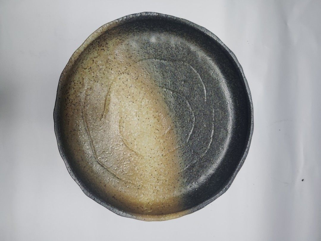 Handmade Ceramic Serving Plate Rustic Earth Tones (Category: Dinnerware & Cutlery) located in Manila. Submitted by epicrabbit-968a (Listing ID 1461748635, Image 2). Description: - Rustic ceramic plate - Unique earth-toned glaze - Textured surface for character - Approx. 10-inch diameter - Versatile: great for serving or as a decorative piece -japanese earthen wares -sale @150 each, orig price @300-500.