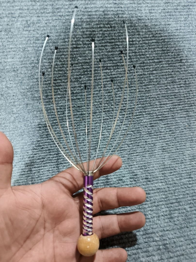 Head massager (Category: Massage Devices) located in San Leonardo. Submitted by burgossanleonardo.12345 (Listing ID 1461715692, Image 1). Description: Head massager Self massage With handles Silver and violet handle color Good for relaxing.