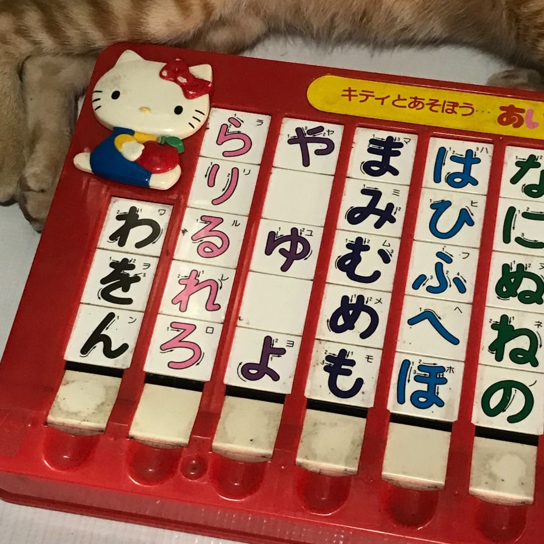 Hello Kitty AIUEO Hiragana study Toy #4983 (Category: Educational & Learning Toys) located in Malabon City. Submitted by mldg.surplus (Listing ID 1461638969, Image 3). Description: - Vintage Kitty toy for learning Japanese hiragana. - Features a red plastic base with movable tiles. - A fun and unique educational tool for introducing Japanese writing. - Great for collectors or as a nostalgic gift..