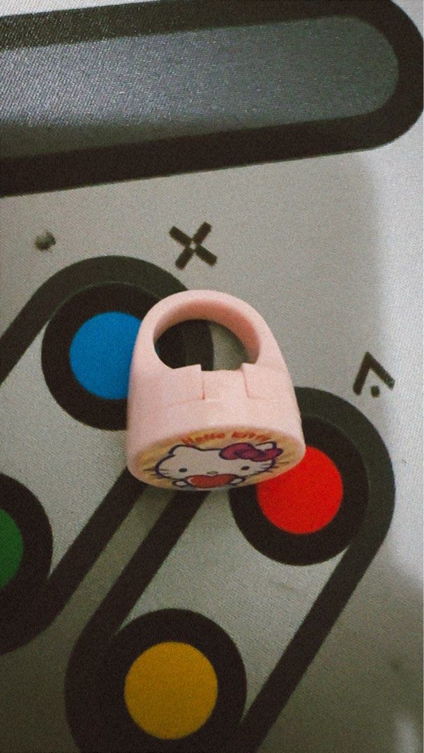 Hello Kitty Lip Balm Pink Compact gacha (Category: Makeup) located in Manila. Submitted by lunalux09 (Listing ID 1461667737, Image 2). Description: - Adorable pink Kitty lip balm - Features iconic character with a heart design - Compact and portable for on-the-go use - A must-have for any Kitty enthusiast.