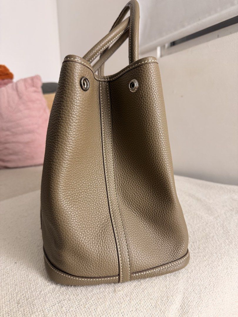 Hermes Garden Party Tote Bag (Category: Luxury Bags & Wallets) located in Manila. Submitted by bellsuaverdez (Listing ID 1461772409, Image 2). Description: Hermès Garden Party Color: Étoupe 2nd owner, rarely use RSF: decluttering, too many bags .