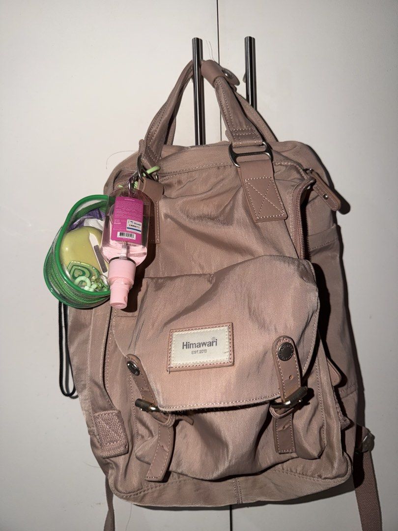 Himawari Backpack - Taupe (Category: Backpacks) located in Manila. Submitted by federicofr41892 (Listing ID 1461589115, Image 2). Description: - Himawari backpack in a stylish taupe color. - Multiple pockets for excellent organization. - Adjustable straps for a comfortable fit. - Comes with a complimentary hand sanitizer. - Includes a detachable green pouch. - Ideal for daily commutes or travel adventures..