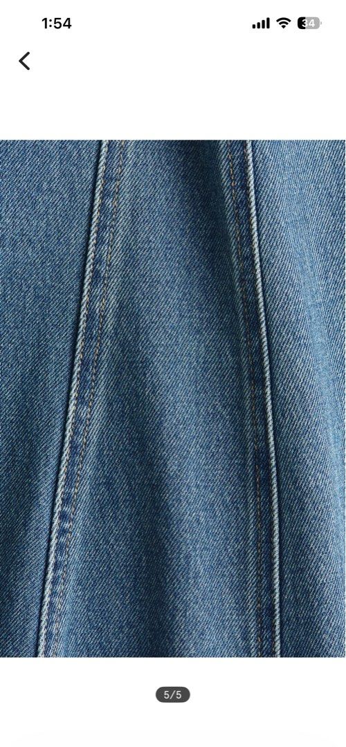 H&M Flared Denim Dress (Category: Dresses) located in Dagupan City. Submitted by embrella (Listing ID 1461612481, Image 3). Description: - Sleeveless denim dress from H&M - Round neckline - Fitted bodice with a flared skirt - Concealed back zipper - Visible front and back seams - Made of 100% cotton.