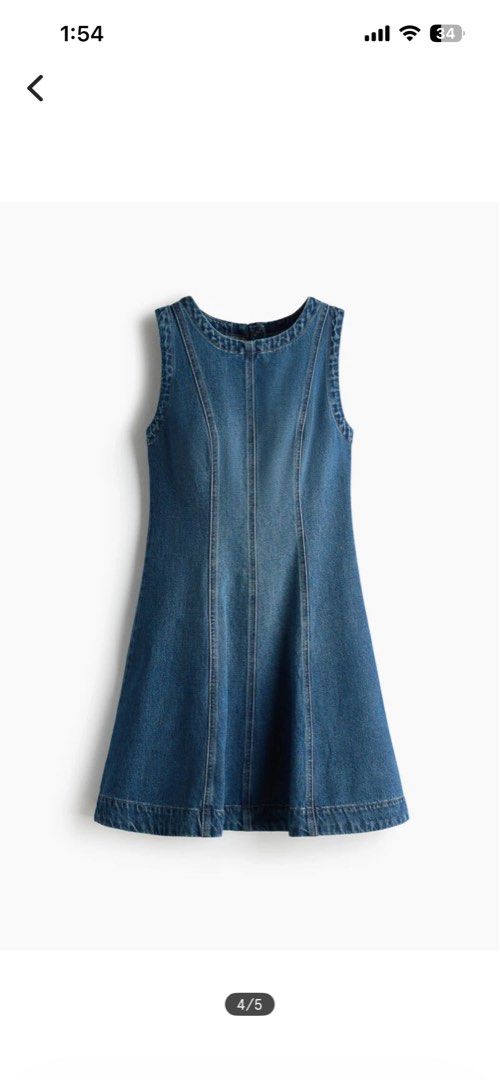 H&M Flared Denim Dress (Category: Dresses) located in Dagupan City. Submitted by embrella (Listing ID 1461612481, Image 2). Description: - Sleeveless denim dress from H&M - Round neckline - Fitted bodice with a flared skirt - Concealed back zipper - Visible front and back seams - Made of 100% cotton.