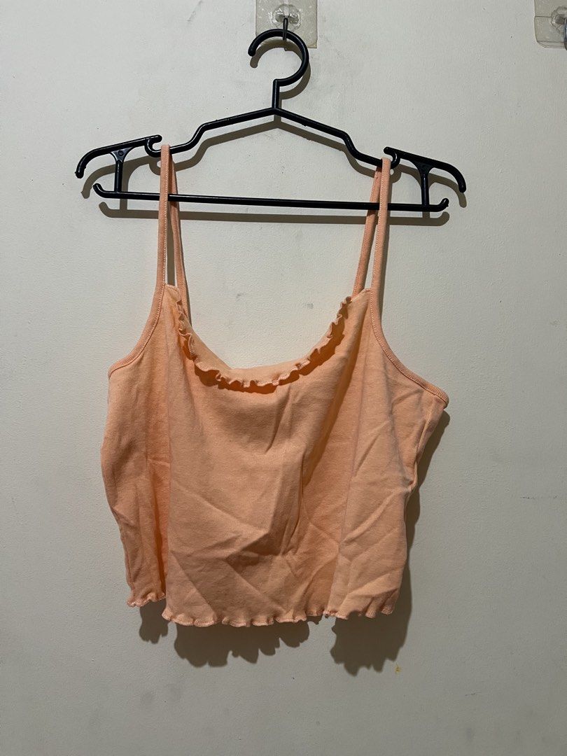 H&M Orange Lettuce Hem Crop Top (Category: Shirts) located in Marikina City. Submitted by kzells13 (Listing ID 1461579880, Image 2). Description: - Brand: H&M - Color: Orange - Style: Crop top - Details: Lettuce hem on neckline and hem, spaghetti straps - Condition: Brand new with tag, never worn - Occasion: Casual wear, layering.