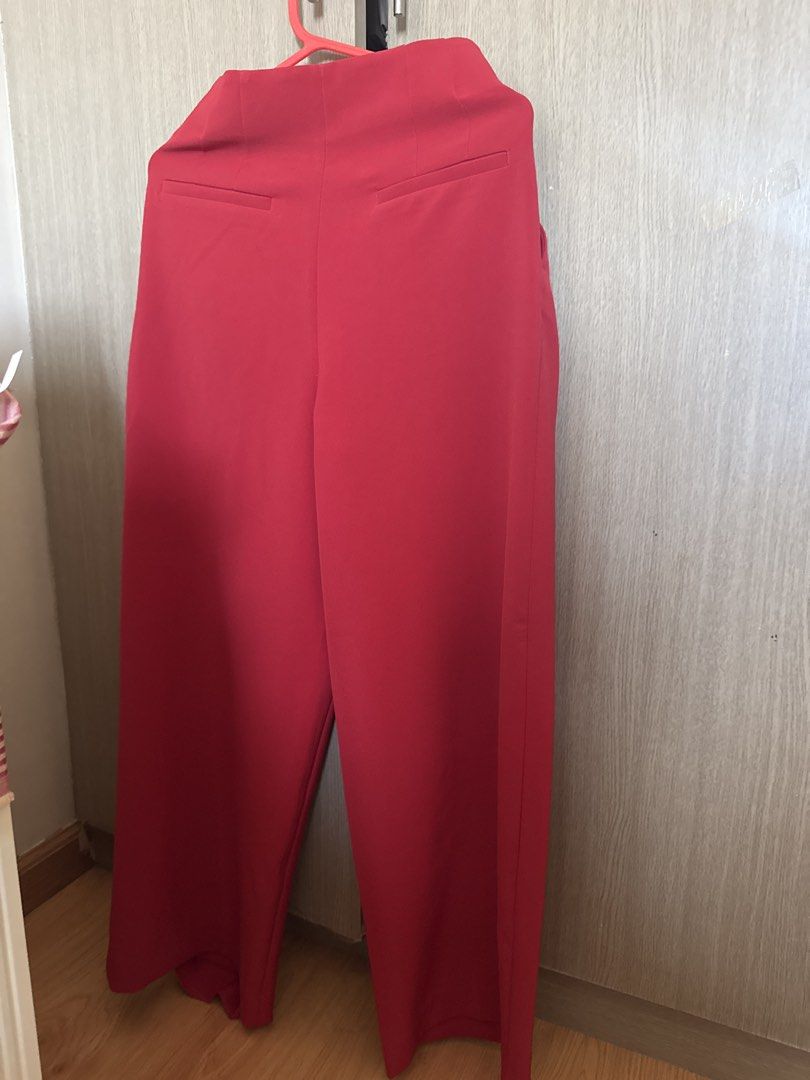H&M Red Wide Leg High Waisted Pants (Category: Jeans) located in Manila. Submitted by maryann22cabig (Listing ID 1461626546, Image 2). Description: - Red wide leg pants from H&M - High-waisted with front pleats - Two pockets at the back - Comfortable fit - Perfect for dressing up or down.