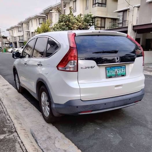 Honda CR-V 2.0 i-VTEC (A) (Category: Used Cars) located in San Juan City. Submitted by albramos (Listing ID 1461589251, Image 2). Description: Honda CR-V 2013 (Acquired 2014) Helping a friend sell this well-maintained and very low mileage SUV. ✔ Model: Honda CR-V 2013 ✔ Acquired: 2014 ✔ Mileage: 79,000 km ODO (Very Low Mileage) ✔ Color: White ✔ Condition: Excellent, Ready for Long Drive – All stock ✔ Interior: Intact and very clean ✔ Registration