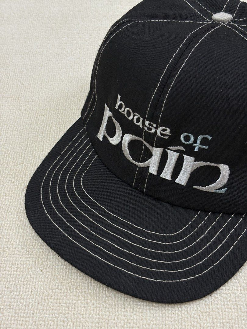 House Of Pain Hat (Category: Caps & Hats) located in Manila. Submitted by porma.market (Listing ID 1461578320, Image 1). Description: - Classic black baseball cap - Embroidered 'House of Pain' logo on the front - White stitching details for a clean look - Unique light blue shamrock design inside - Adjustable strap for a customized fit - Ideal for casual wear and everyday outfits - Gems💎 -90s hat.