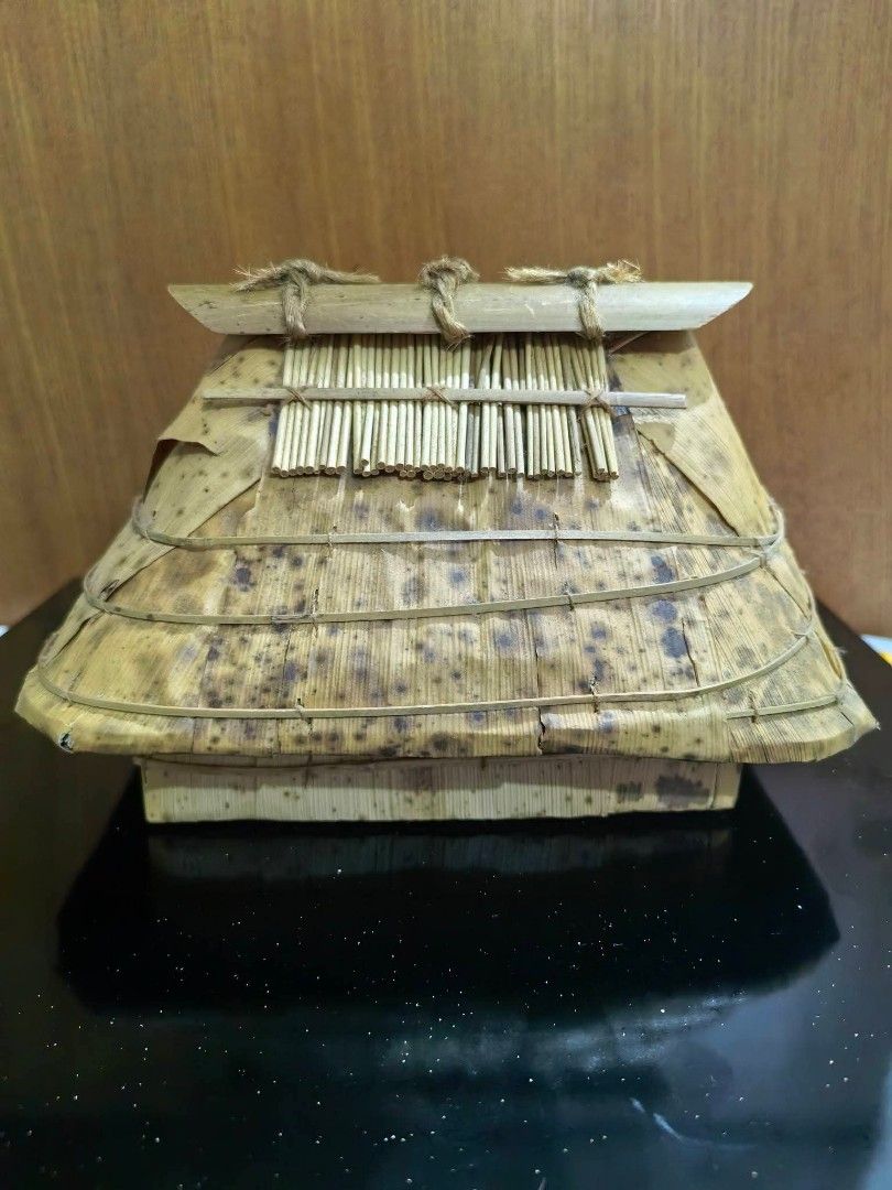 House-shaped Native Container (Category: Other Home Decor) located in Cebu City. Submitted by dudes_villanueva (Listing ID 1461660041, Image 1). Description: House-shaped Native Container or Trinket Box 📌 Crafted from bamboo sheath (také-kawa in Japanese craft styles or similar tropical plant fiber/bamboo leaf crafts), featuring a layered thatched-style roof. 📌 Specks are natural. Not an issue. See all pics for condition. L7.25xW5xH4.5 in.