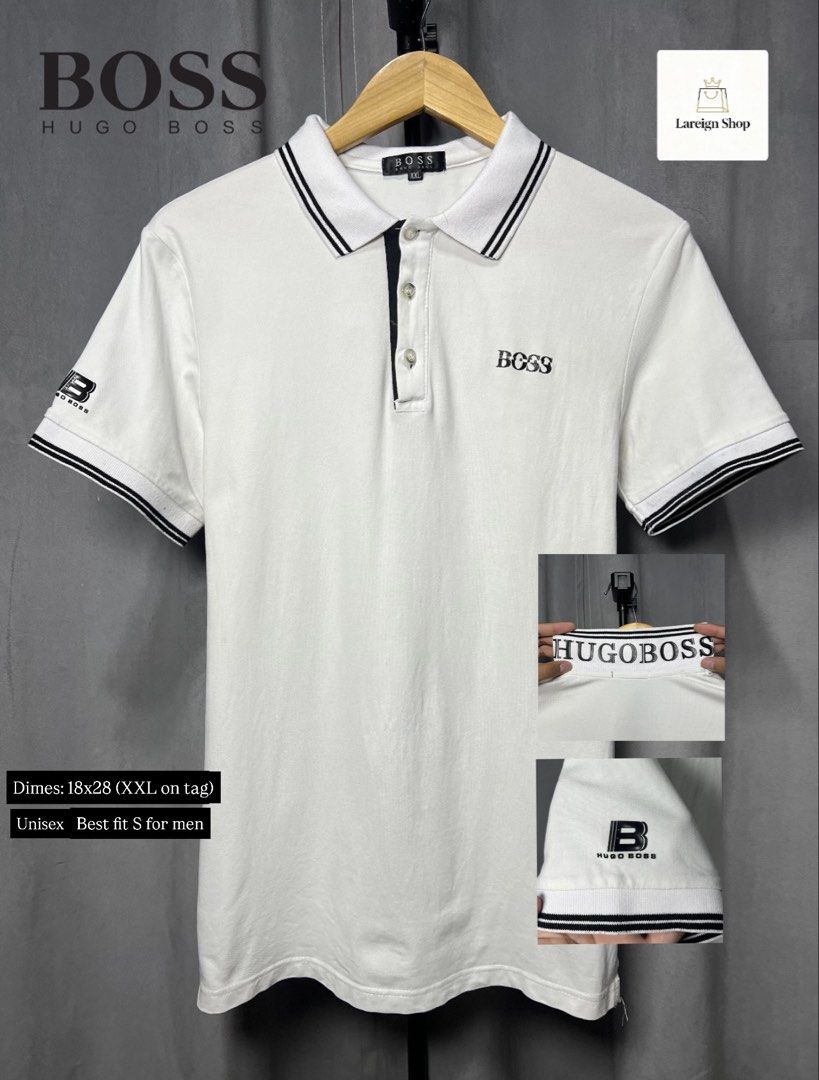 HUGO BOSS White Polo Shirt (Category: Tshirts & Polo Shirts ) located in Luna. Submitted by lareign (Listing ID 1461589908, Image 1). Description: - White HUGO BOSS polo shirt - Black striped collar and sleeve cuffs - Small BOSS logo on chest - Larger HUGO BOSS logo on sleeve -Best fits men's size S -Rubber embossed/ print - Great for unisex wear.