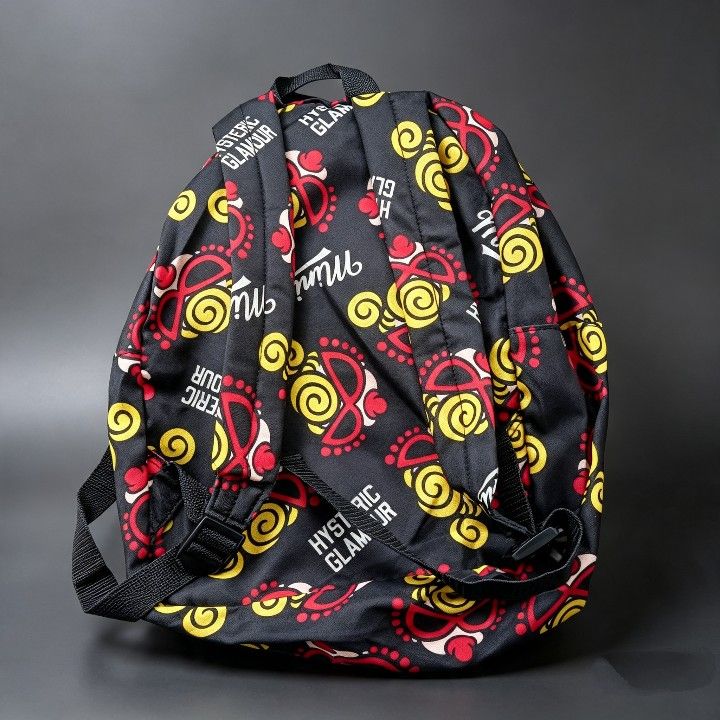 Hysteric Glamour Mini Backpack - All Over Print (Category: Backpacks) located in Baguio. Submitted by miishaysh67446 (Listing ID 1461665721, Image 2). Description: - Brand: Hysteric Glamour - Style: Mini Backpack - Color: Black base - Design: All-over print of sunglasses and swirls - Compartments: Main compartment and front pocket - Straps: Adjustable for comfort - Use: Ideal for everyday wear or as a statement accessory.