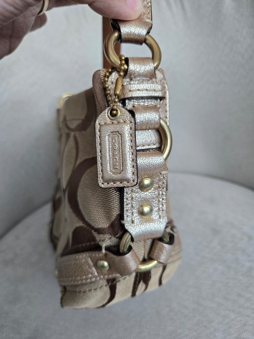 INCH!!! Coach Carly Small Monogram (Category: Luxury Bags & Wallets) located in Manila. Submitted by shla.dln (Listing ID 1461603077, Image 3). Description: - Classic Coach shoulder bag - Signature monogram canvas in tan and brown - Metallic gold leather trim - Gold hardware details - Secure zipper closure - Stylish and practical for everyday use.