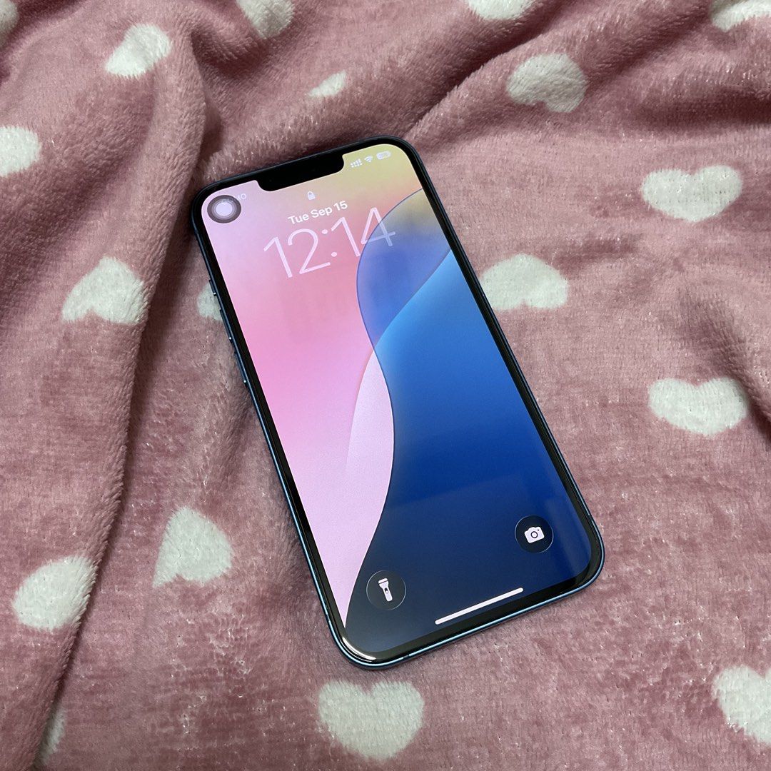 iPhone 13 256GB (Category: iPhone 13 Series) located in Antipolo. Submitted by declutteredthrifts (Listing ID 1461758340, Image 2). Description: - 256GB in blue - battery health maximum capacity: 76% - no sim restrictions - no history of repairs - no glass cracks and scratches - minor paint chip on camera borders - inclusions: > box > original charging cable > original iphone (product red) liquid silicone case > black otterbox otterpop phone case